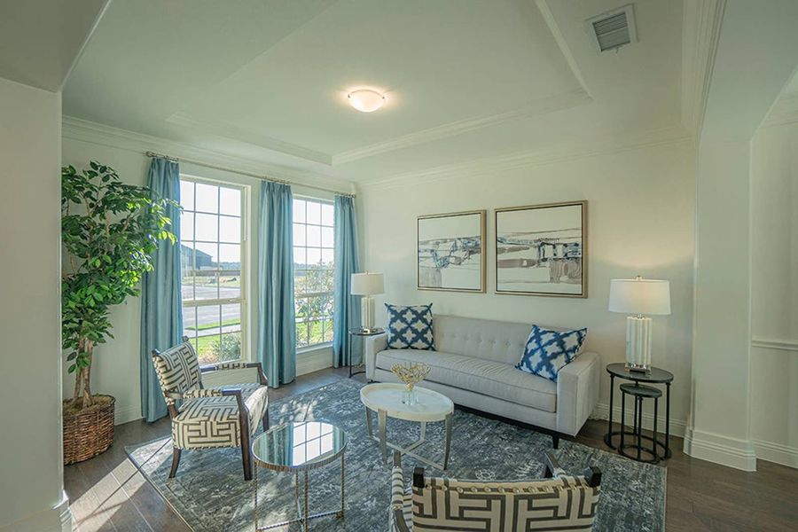 Furnished interior in a model home at Woodcreek in Fate (Image 4).