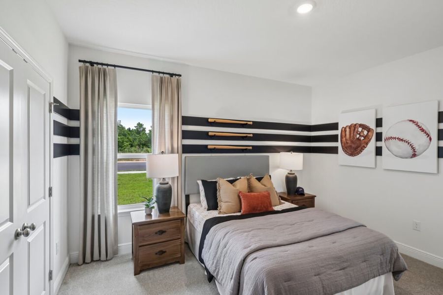 Furnished interior in a model home at Mahogany At Jubilee in Pace (Image 36).
