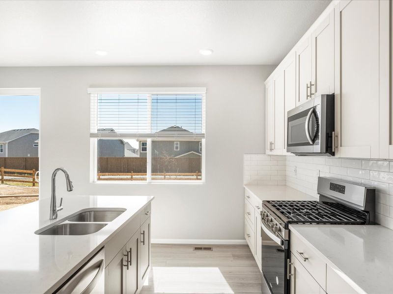 Waterton floorplan interior image taken at a Meritage Homes community in Brighton, CO.