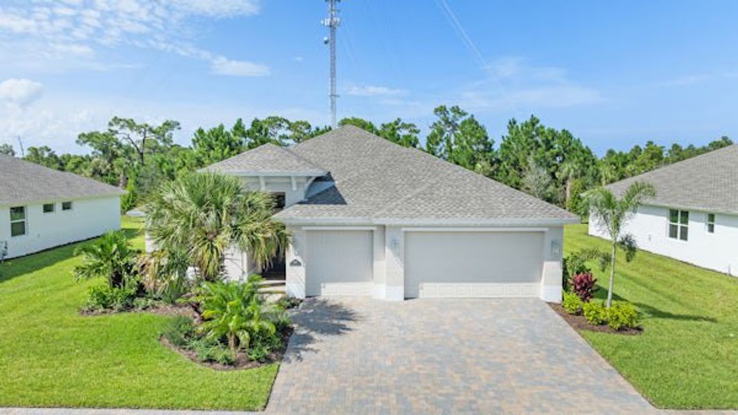 Front exterior of a home in the High Pointe community, located in Vero Beach, FL (Image 57).