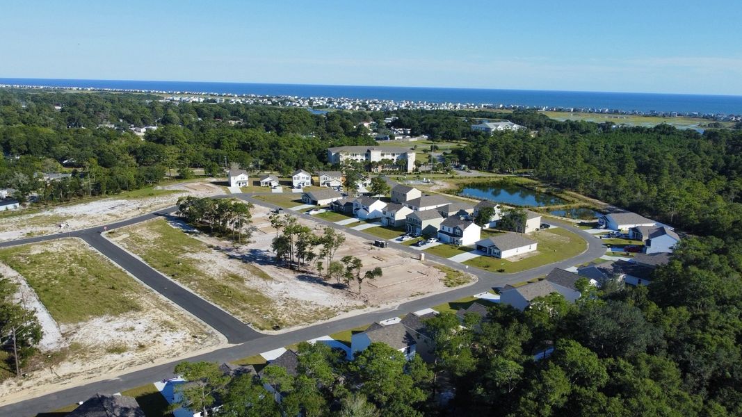 A landscape with houses and trees.