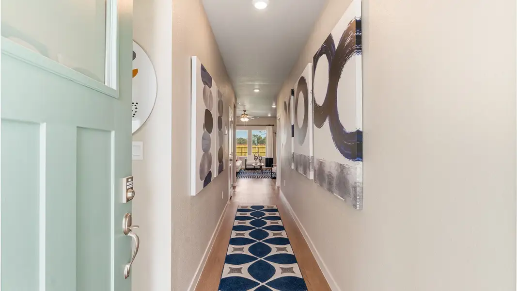 Furnished interior in a model home at Kokomo in Rockport (Image 4).