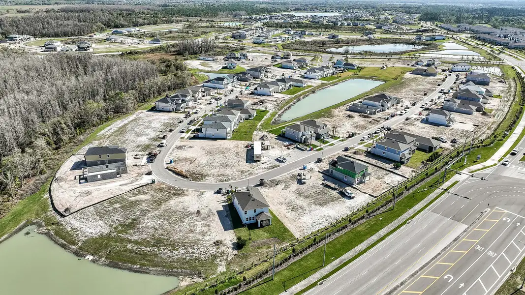 Aerial view of the Chapel Crossings - Garden Series community in Wesley Chapel, FL, showing layout and nearby surroundings (Image 1).