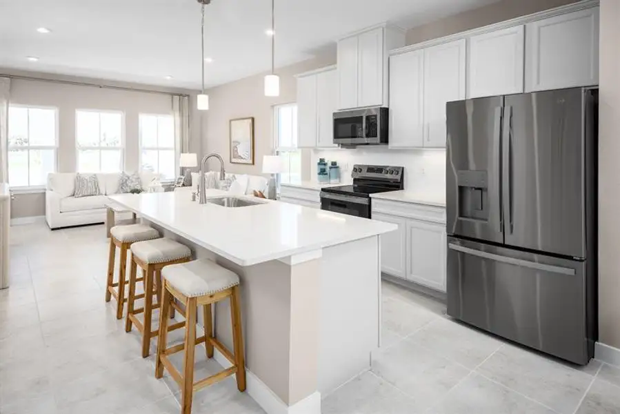 Furnished interior in a model home at Lake Mattie Preserve Townhomes in Auburndale (Image 6).