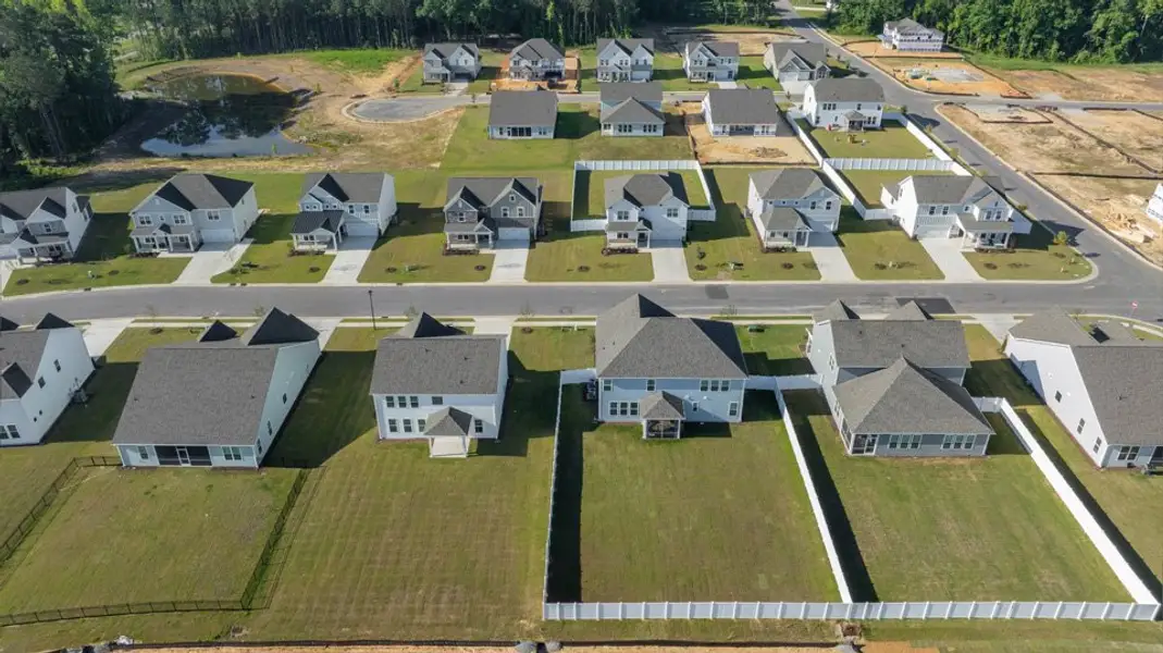 Aerial view of the Eagle Creek community in Fuquay Varina, NC, showing layout and nearby surroundings (Image 1). Aerial view of the Eagle Creek community in Fuquay Varina, NC, showing layout and nearby surroundings (Image 1).
