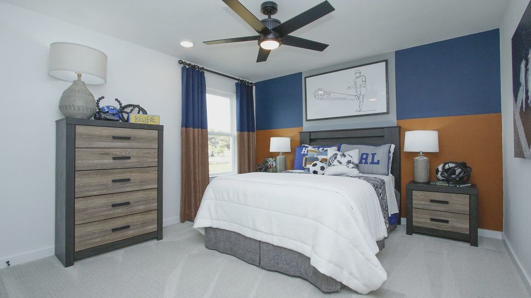 Dual-tone walls and sleek furniture enhance this contemporary bedroom in Pinehurst.