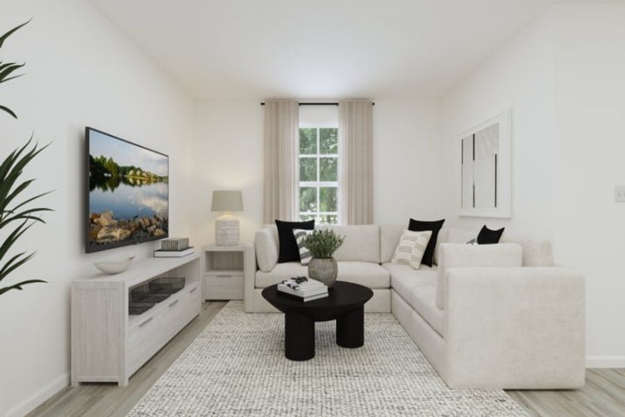A living room with a white couch and a coffee table. A living room with a white couch and a coffee table.