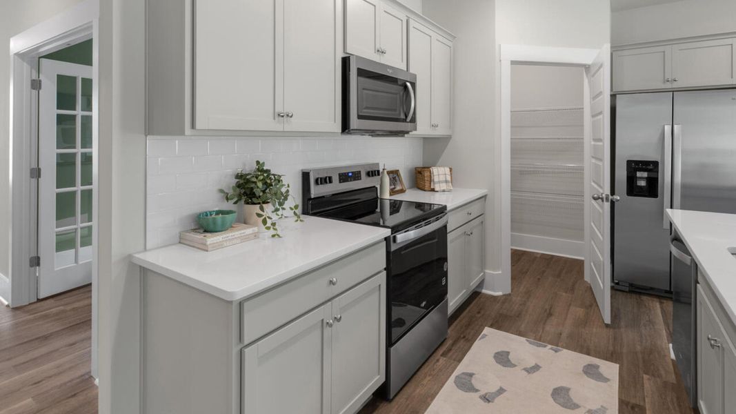 Furnished interior in a model home at The Grove at Blake Farm in Wilmington (Image 22).