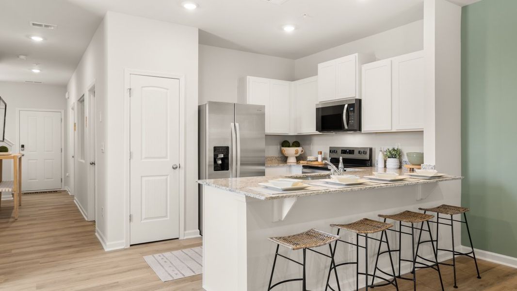 Furnished interior in a model home at Roseleigh Park in Douglasville (Image 6).