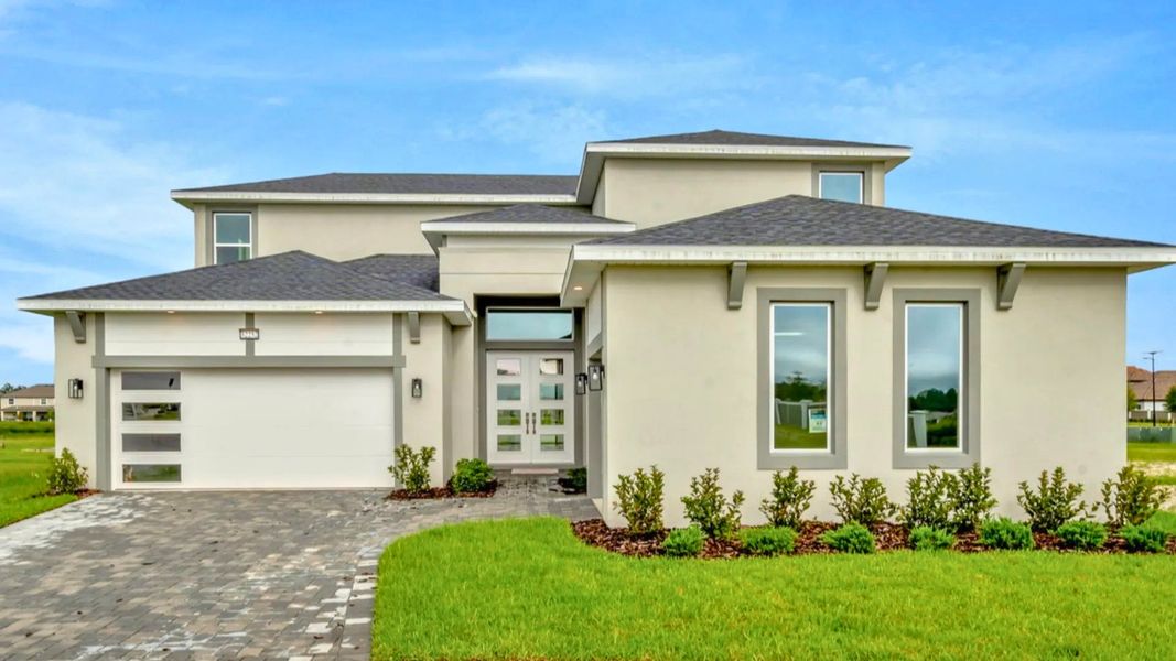 Front exterior of a home in the Eagles Cove at Mirada community, located in San Antonio, FL (Image 12).