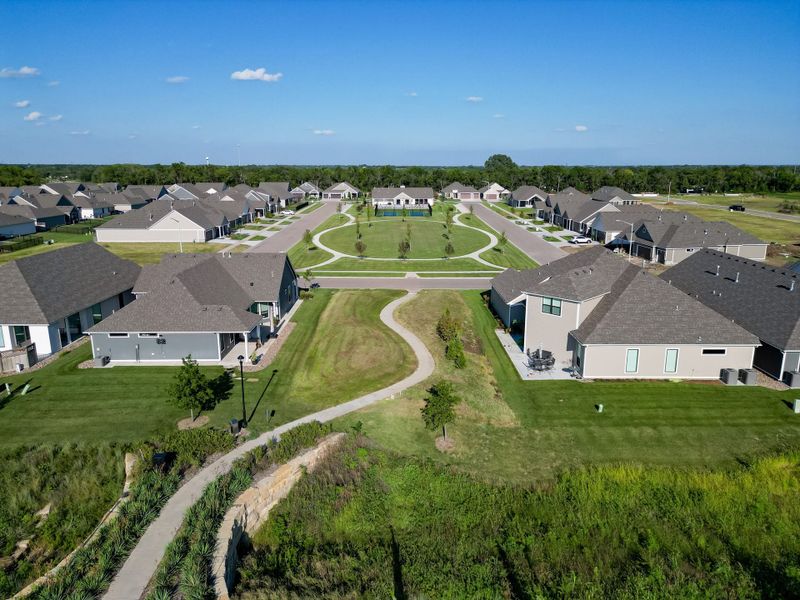 Aerial view of the The Courtyards at The Heritage community in Andover, KS, showing layout and nearby surroundings (Image 25). Aerial view of the The Courtyards at The Heritage community in Andover, KS, showing layout and nearby surroundings (Image 25).