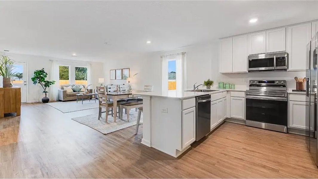 Furnished interior in a model home at Eagle's Ridge: Watermill in Pace (Image 7).