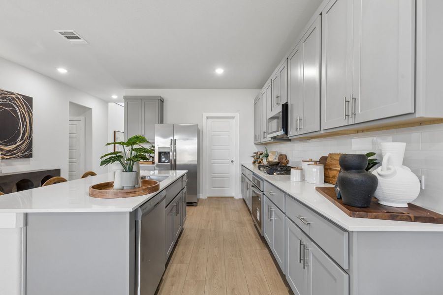 Kitchen in the Winters model home in Gunter TX by Trophy Signature Homes