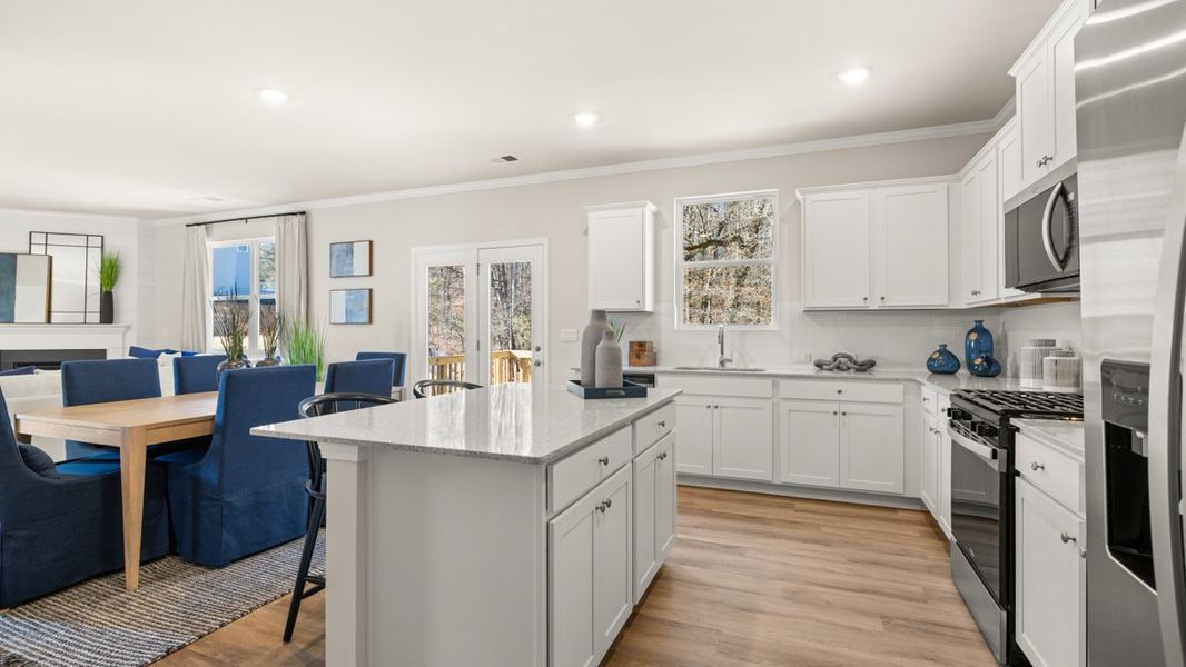 Furnished interior in a model home at Liberty Crossing in Braselton (Image 10).