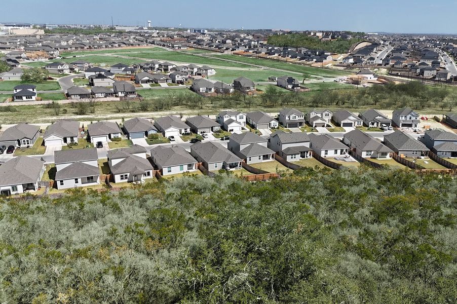 Aerial view of the Hunters Ranch community in San Antonio, TX, showing layout and nearby surroundings (Image 1). Aerial view of the Hunters Ranch community in San Antonio, TX, showing layout and nearby surroundings (Image 1).