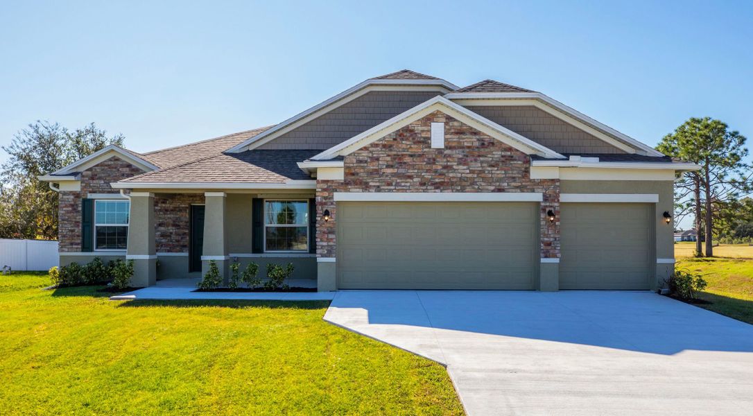 Front exterior of a home in the Applewood Reserve community, located in Lakeland, FL (Image 1).