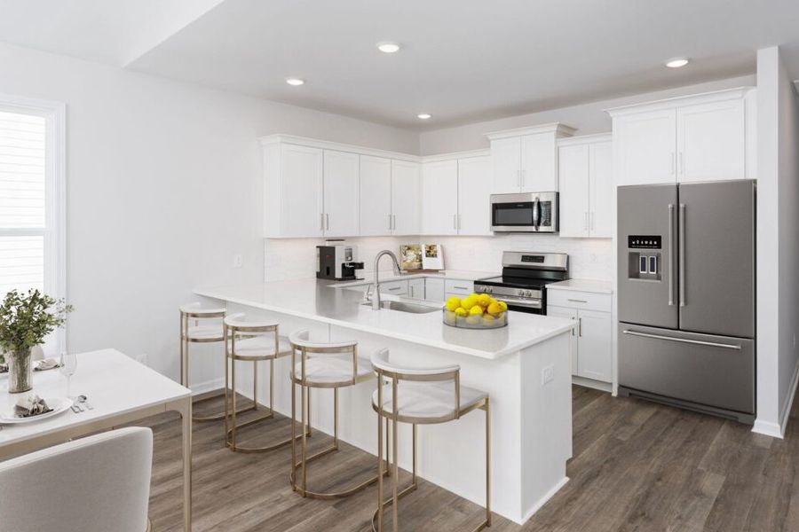 Furnished interior in a model home at River Hills in Shallotte (Image 7).