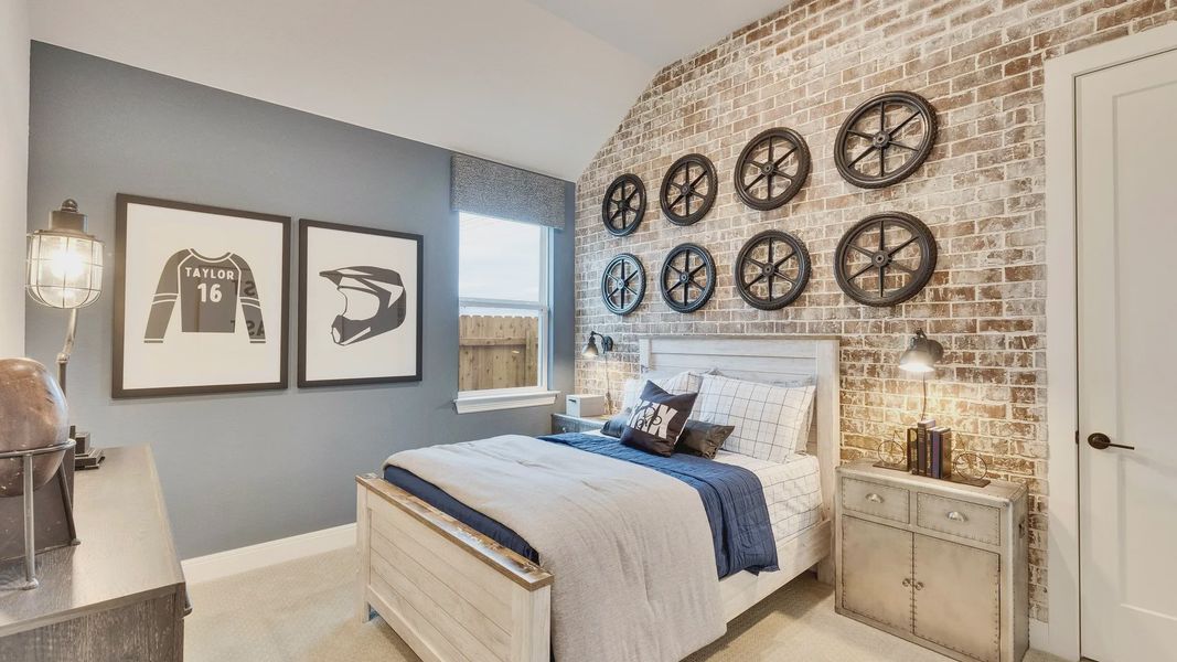 Experience refined living with a stylish brick accent wall and unique wheel decor in Spring Creek.