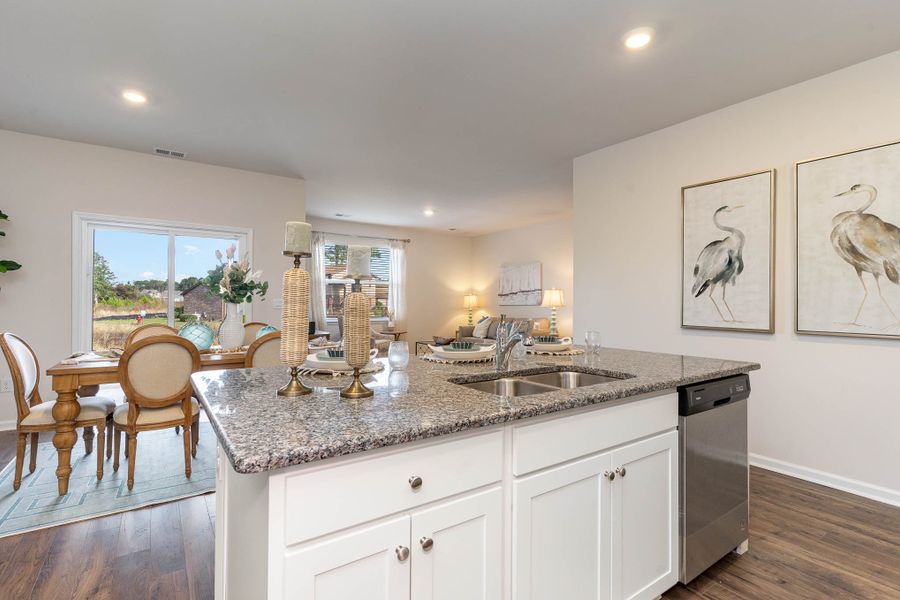 Furnished interior in a model home at Island Green in Myrtle Beach (Image 58).