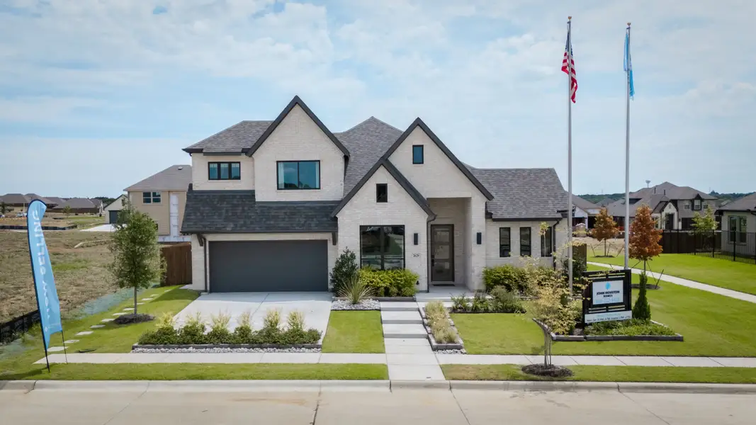 Front exterior of a home in the The Parks at Panchasarp Farms - Phase 3 community, located in Burleson, TX (Image 1). Front exterior of a home in the The Parks at Panchasarp Farms - Phase 3 community, located in Burleson, TX (Image 1).