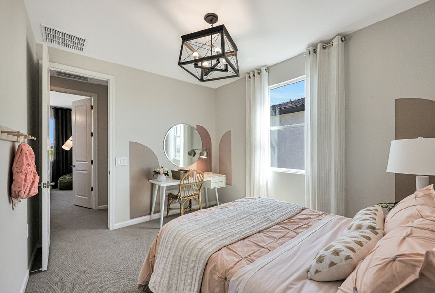 A bedroom with a large mirror. A bedroom with a large mirror.