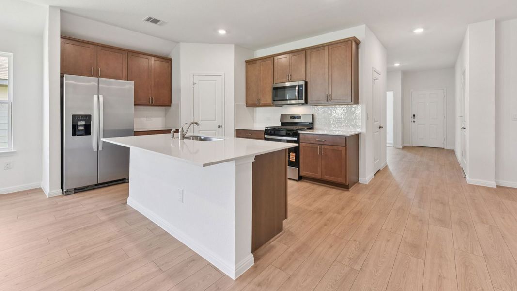 Furnished interior in a model home at Carillon in Manor (Image 7).