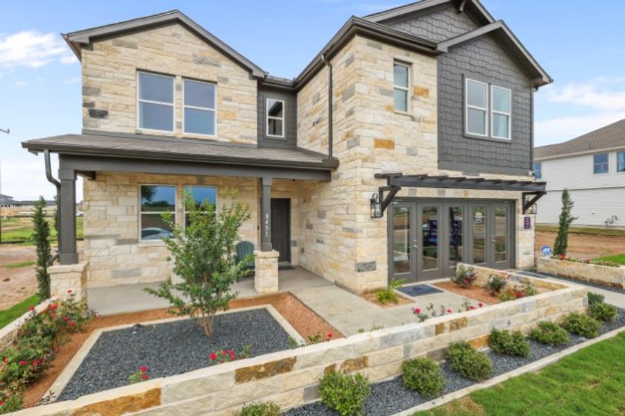 A house with a stone driveway. A house with a stone driveway.