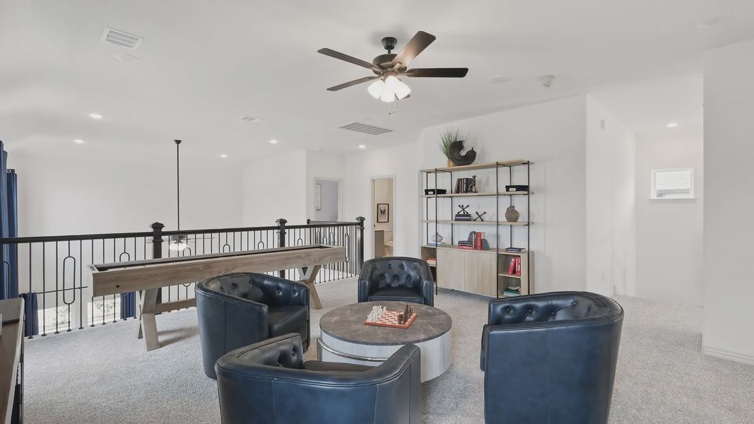 Sophisticated loft with plush seating, artistic shelving, and elegant railing in Westridge, Texas.