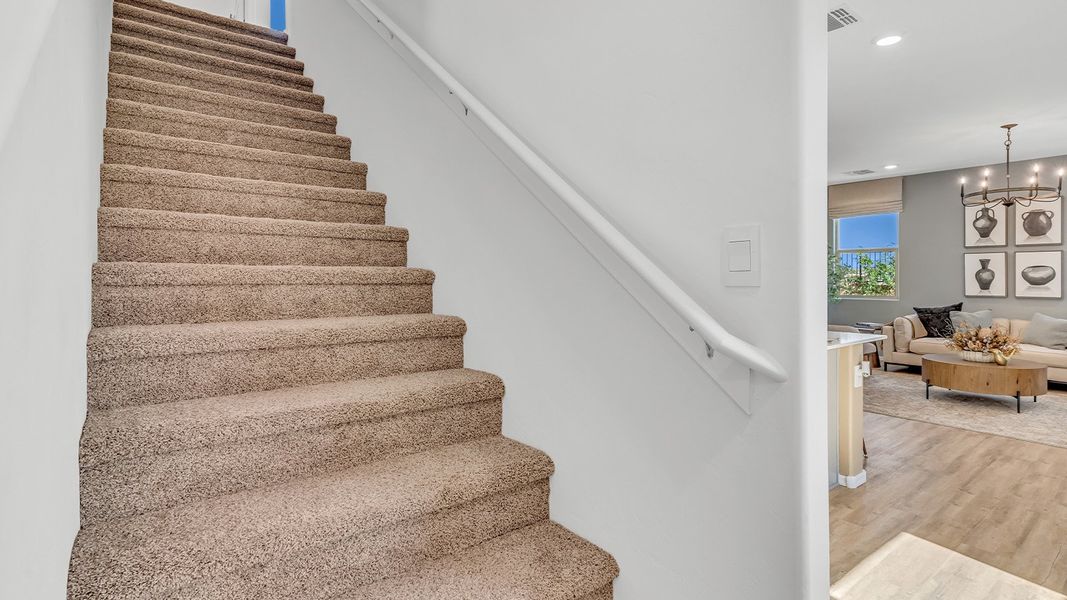 Furnished interior in a model home at Coronet at Gladden Farms in Marana (Image 59).