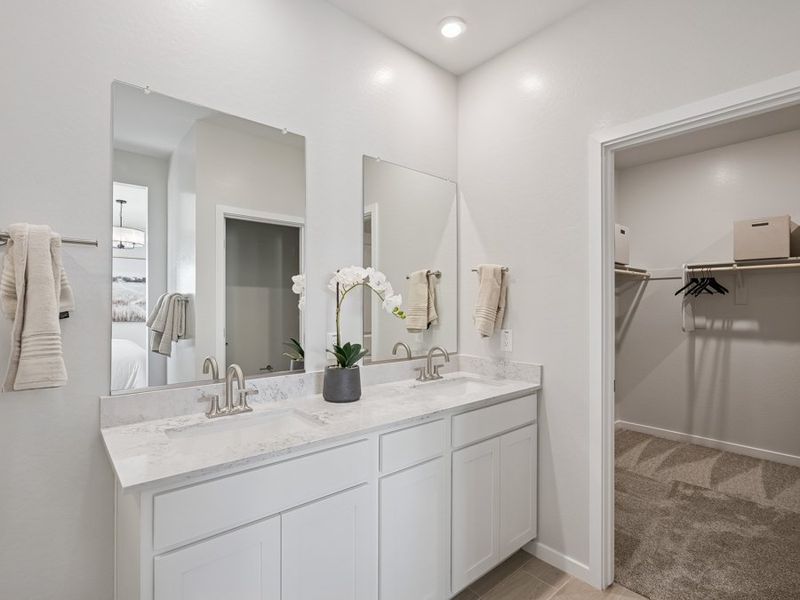 A bathroom with a tub sink and mirror. A bathroom with a tub sink and mirror.