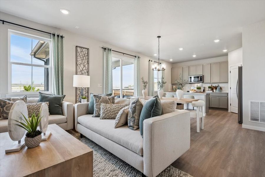 A living room with a couch and a table.
