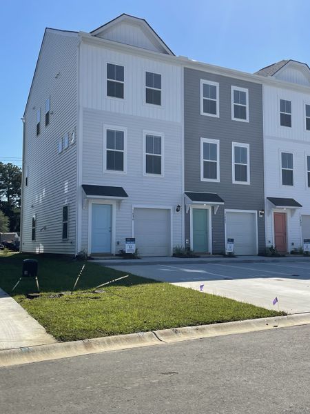 Modern townhomes with varied siding in Clear Springs Townhomes by DRB Homes (North Charleston, SC).