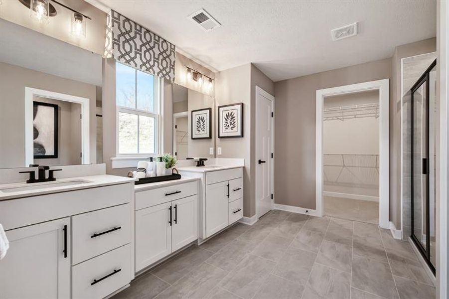 Enjoy an owner’s bath with dual sinks, plenty of storage, and a spacious shower or soaking tub.