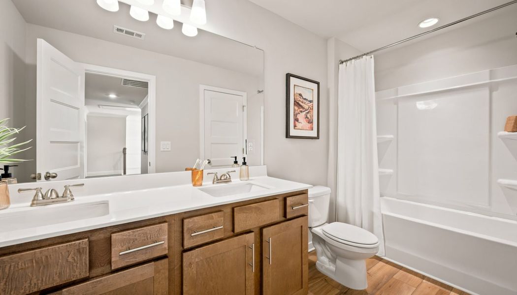 Furnished interior in a model home at Fowler Farms in Auburn (Image 57).