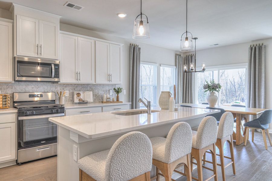 Prep dinner in the kitchen without missing the conversation in the dining area. Prep dinner in the kitchen without missing the conversation in the dining area.