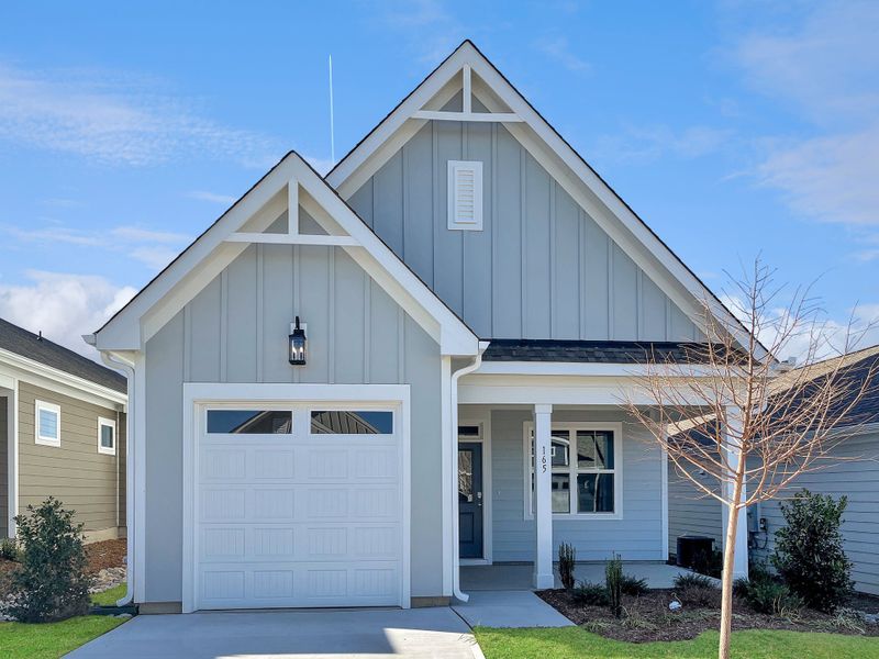 Front exterior of a home in the The Walk at East Village community, located in Clayton, NC (Image 26). Front exterior of a home in the The Walk at East Village community, located in Clayton, NC (Image 26).