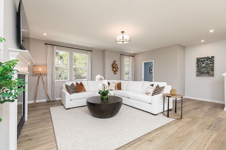 Spacious family room with a fireplace, perfect for relaxing and hosting friends and family