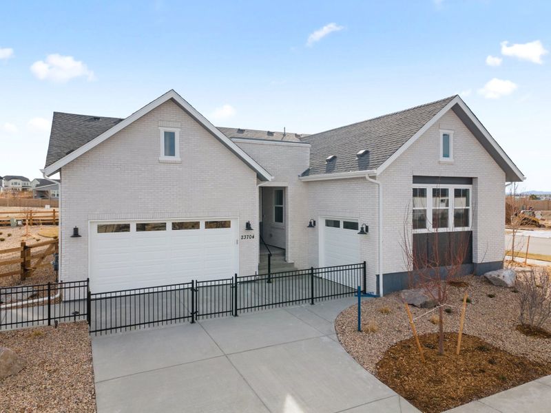 Front exterior of a home in the The Aurora Highlands community, located in Aurora, CO (Image 5).
