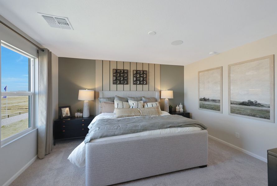 A bedroom with a large bed. A bedroom with a large bed.