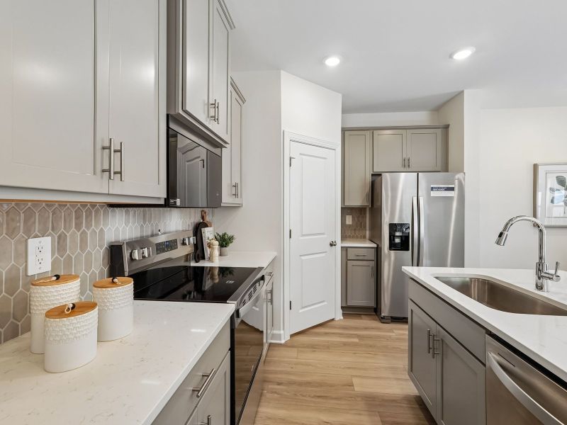 Furnished interior in a model home at Rocky River Towns in Charlotte (Image 9).