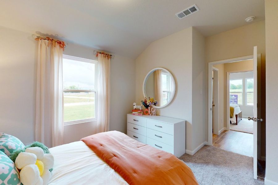 A bedroom with a large mirror. A bedroom with a large mirror.