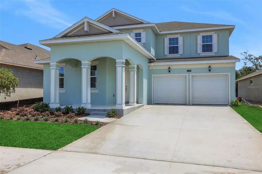 Front exterior of a home in the Serenade at Ovation 50' community, located in Oakland, FL (Image 10).