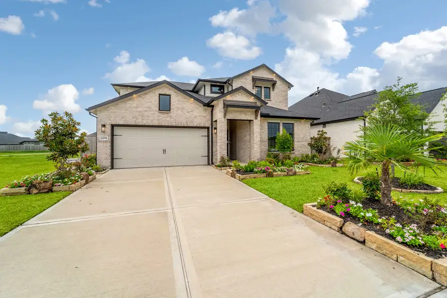Front exterior of a home in the Mulberry Farms community, located in Santa Fe, TX (Image 9).