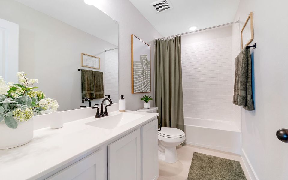 Furnished interior in a model home at Grande Estates in Bertram (Image 37).