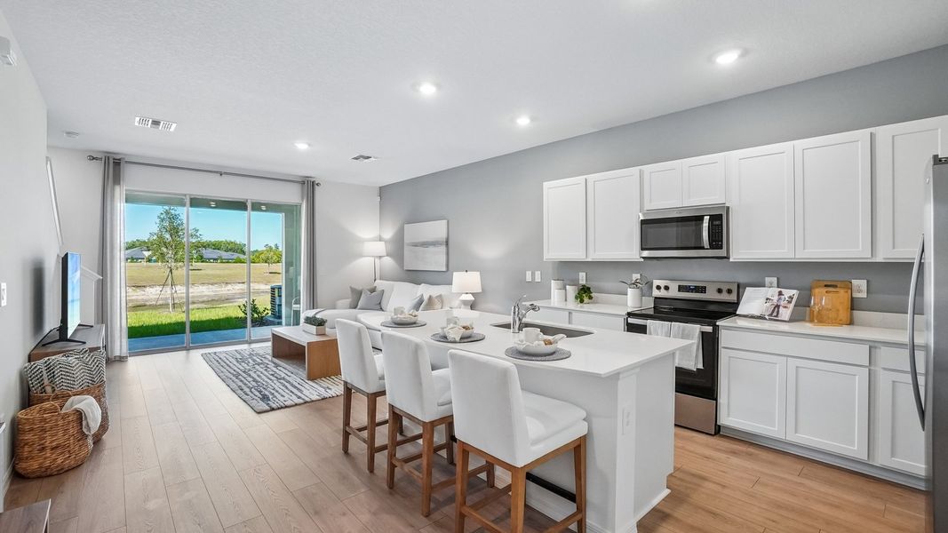 Furnished interior in a model home at Sanctuary at Citrus Park Townhomes in Tampa (Image 8).