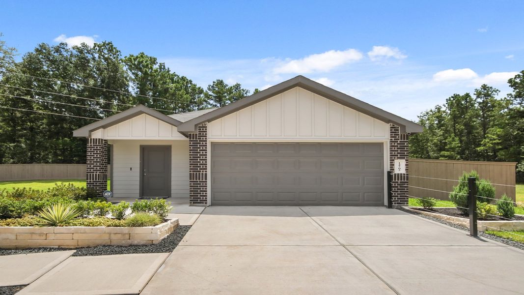Front exterior of a home in the Mill Creek community, located in Magnolia, TX (Image 5).