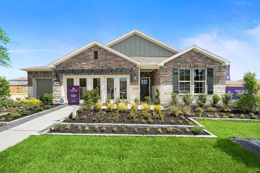 A house with a fountain in the front.