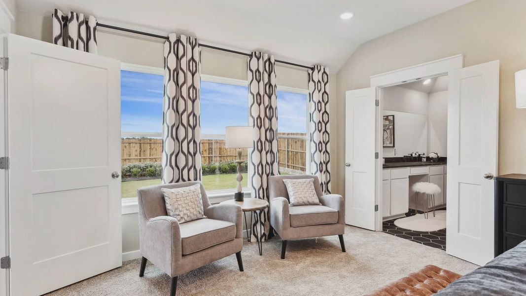 Elegant living space featuring plush carpet, geometric curtains, and seamless outdoor views in Simpson Crossing.