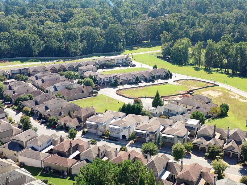 Aerial view of the The Village at Towne Lake community in Woodstock, GA, showing layout and nearby surroundings (Image 1).