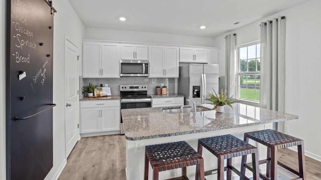 Furnished interior in a model home at Chicod Landing in Greenville (Image 13).